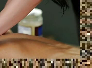 Lezzie masseuse rubs clit