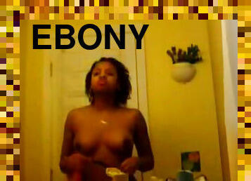 Slender ebony is posing naked in the shower