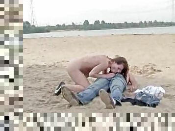 Naked girl sucks him and rides him at beach