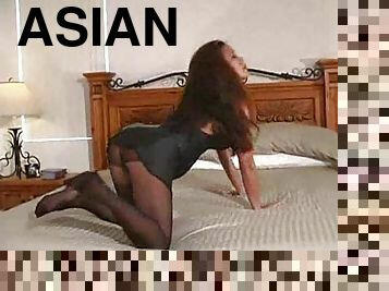 Asian in sultry pantyhose showing off
