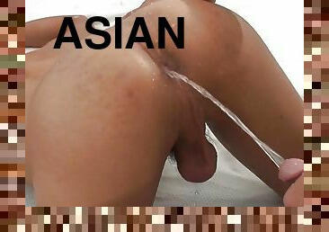 Pissing Asian bottom drilled in asshole by bareback lover