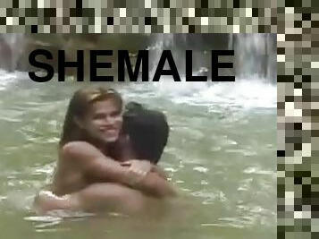 Shemale and a guy swim in a river and do some hot fucking