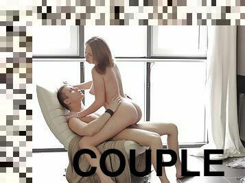 A couple gets their fuck on in front of a big window