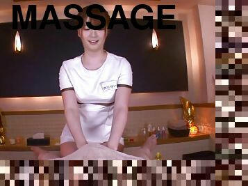 Smiling massage girl jerks him and makes him explode