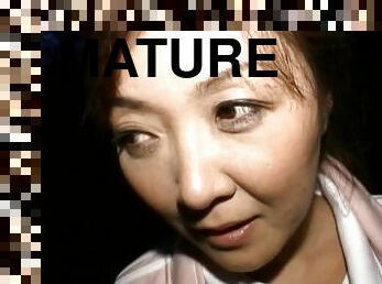 Mature Japanese woman giving a handjob in a homemade video