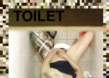 Girl masturbates on the toilet