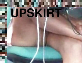 Upskirts of girl at computer