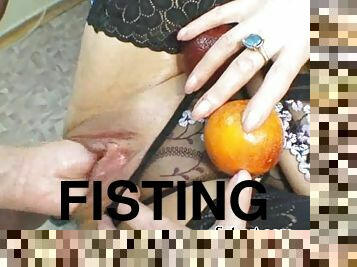 Fisting her wet and squirting pussy