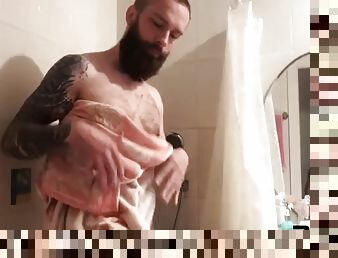 Dirty tattooed pervert wanks cock in the bathroom while doing laundry