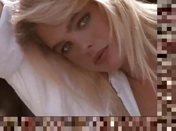 Vintage blonde Peggy McIntaggart poses for the cam in a bedsheet