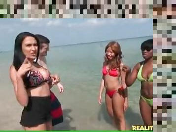Black chicks look hot on the beach in bikinis