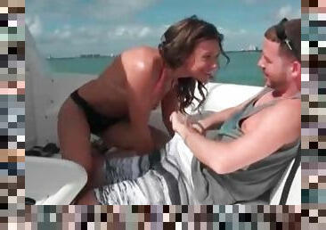 Brunette bikini girl gives a blowjob on the boat