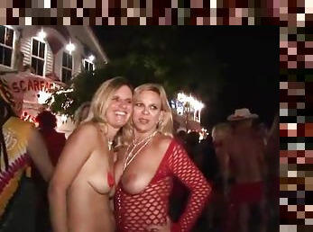 Scantily clad costume girls at street party