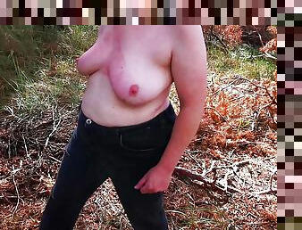 Walking naked through forest while slapping her tits