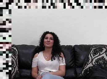 Curly haired amateur Hollie gets cum on face on the casting couch