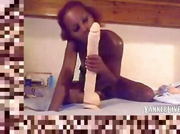 Naughty black babe on webcam fucks herself with huge dildo and teasing