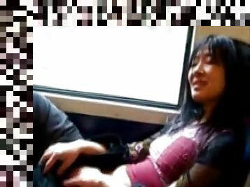 Asian milf masturbates pussy in the train