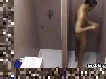 Voyeur view of a guy taking a sexy shower