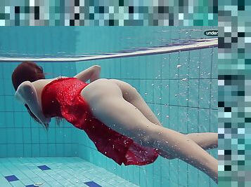 Gorgeous Russian girl swims around the pool showing her private parts