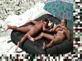 Couple masturbates and fucks on the beach