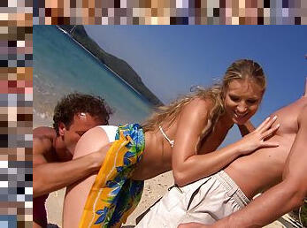 Hot blonde Katy Caro enjoys a threesome with strangers on the beach