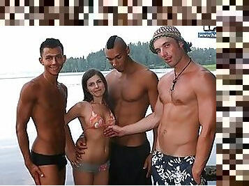 Three muscled dudes take this lovely brunette around their cocks