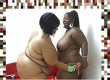 Two adult black fatties have a lesbian fuck on the sofa