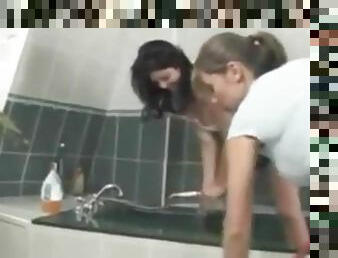 Gorgeous babes are having fun together with a neighbor in the bathroom