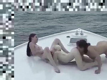 Three teens on a boat having lesbian sex