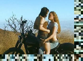 Nasty lezzies Beverly Hills and Daisy Layne fuck outdoor on the motorbike