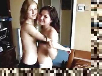 Two horny lesbians touch each other's tits and strip