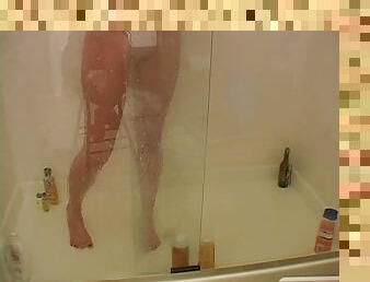 Blonde Austin taking a shower and shaving her legs