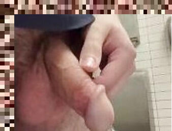 Male pissing in public restroom