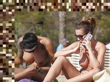 Topless beach babes have amazing big tits