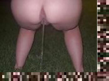 Peeing outside on the grass in mini skirt after drinks leaving night club