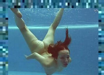 Teen goes swimming in lingerie and gets naked in the pool