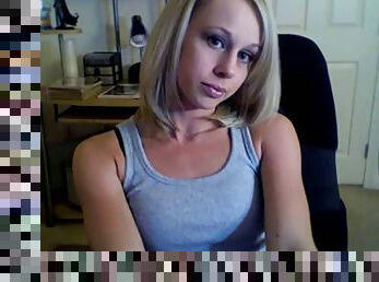 Alluring blonde Li Ann strokes her nice body in front of a webcam