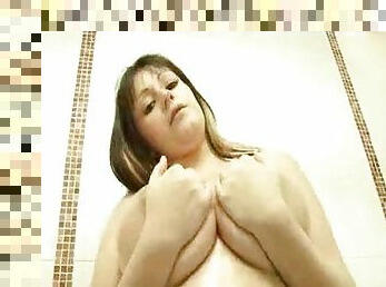 Hottie in the shower showing off big tits