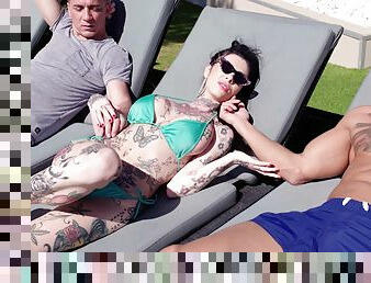 Outdoor threesome by the pool with tattooed model Megan Inky