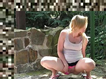 Pink panties girl takes a big piss in public