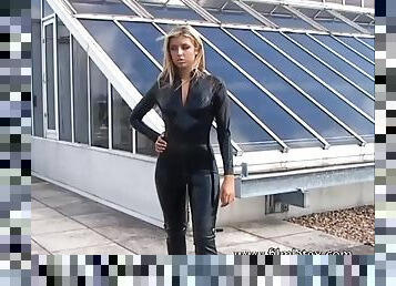 Blonde latex-babes outdoor knee boots and high heels of fetish girl in tight full body rubber outfit with softcore glamour model Karina outside on ...