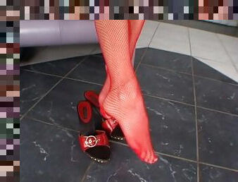 Bitch In Red Fishnet Stockings Shows Off Her Feet
