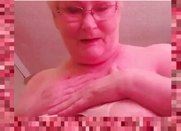 Dirty granny granny plays with her huge boobs and shows her bunny tail for you