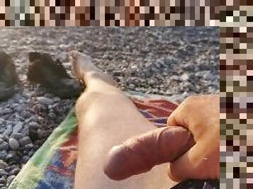 At the beach with a beautiful sea and my cock in the background