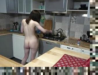Stunning brunnette makes breaskfast in the kitchen completely nude