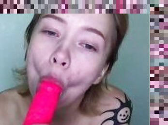 Cute girl sucking a dildo