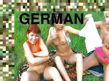 Horny German sluts sharing a police officers cock in nature