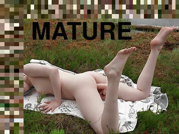 Young Margo Von Tesse masturbates solo on the lawn
