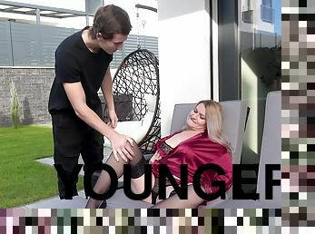 Naughty GILF Dominika Curv fucking with a younger dude on the couch