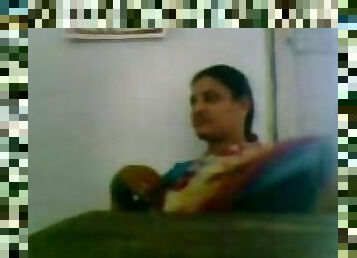 South indian school teacher with her collauge in staffroom